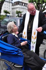2011 Lourdes Pilgrimage - Archbishop Dolan with Malades (262/267)